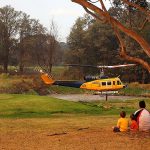 Golf Pitches in to Help Bushfire Victims golf course bushfire helicopter