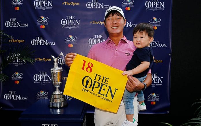 Danny Lee and his son, Roi, pose with the Claret Jug while holding a pin flag after qualifying for the 149th Open Championship at Royal St. George's Golf Club. (Photo by Michael Reaves/R&A/R&A via Getty Images)