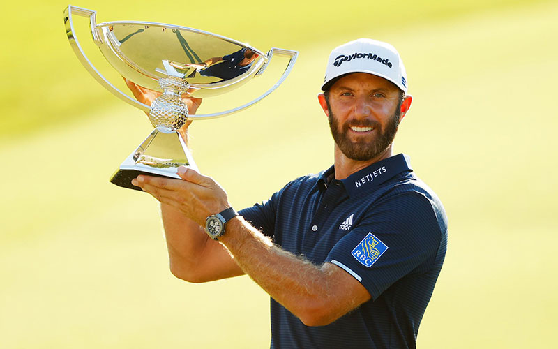 Dustin Johnson with FedEx trophy