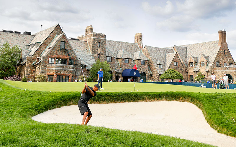 Tiger Woods plays a bunker shot in the practice area during the practice round at the 2020 U.S. Open at Winged Foot Golf Club (West Course) in Mamaroneck, N.Y. on Monday. (USGA/Chris Keane)