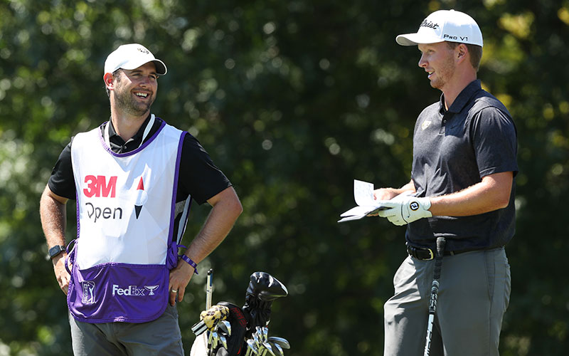 The Caddy Life: Jake Kneen of the United States talks with his caddie, Nick Pumford