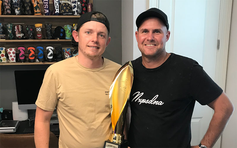 Cam Smith & Sam Pinfold in Hawaii with the Sony Open Trophy which Smith won in January (Supplied)