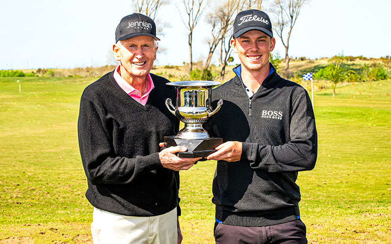 Sir Bob Charles present winner Daniel Hillier with the trophy after winning the DVS Pegasus Open. (NZ Golf)