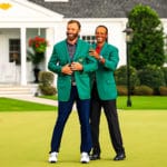 Dustin Johnson Wins His First Green Jacket Tiger Woods puts the green jacket on Dustin Johnson after he won the Masters golf tournament at Augusta National Golf Club.
