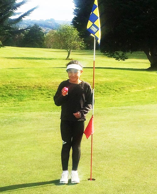 Junior star Maia Koni, 8 years old, after scoring a hole in one on the par three 5th hole at Island Park Saturday club day recently.