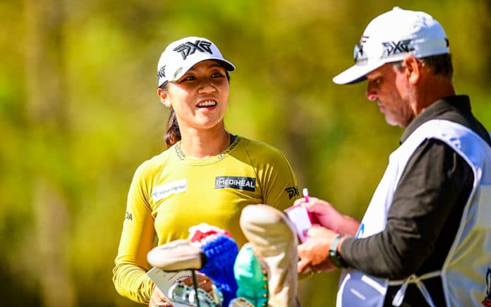 Lydia Ko (L) and her caddie Les Luark (R) confer on the 15th hole during the first round at the 2020 U.S. Women's Open at Champions Golf Club (Jackrabbit Course) in Houston, Texas. (Robert Beck/USGA)