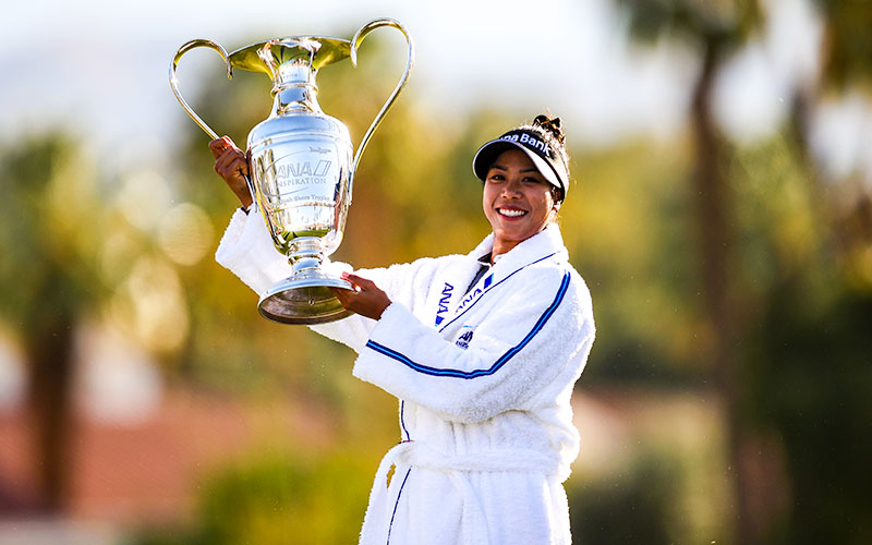 Patty Tavatanakit of Thailand celebrates with the trophy after winning the final round of the ANA Inspiration at the Dinah Shore course at Mission Hills Country Club in Rancho Mirage, California. (Photo by Jed Jacobsohn/Getty Images)