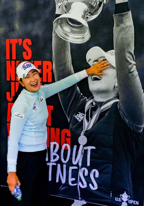 A Lim Kim reacts to seeing a poster of herself during a practice round during the 2021 U.S. Women's Open at The Olympic Club in the San Francisco, Calif. on Monday, May 31, 2021. (Copyright USGA/Jeff Marsh)