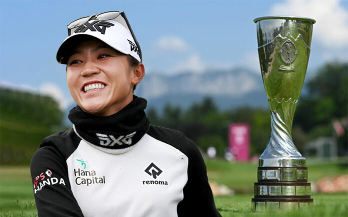 Lydia Ko in front of the Evian trophy