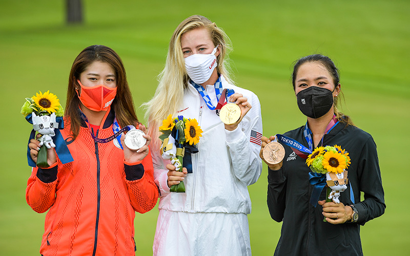 Mone Inami of Team Japan celebrates with the silver medal, Nelly Korda of Team United States celebrates with the gold medal and Lydia Ko of Team New Zealand celebrates with the bronze medal at the Victory Ceremony after the final round of the Women’s Individual Stroke Play event on Day 18 of the Tokyo 2020 Olympics at the Kasumigaseki Country Club on August 7, 2021 in Saitama, Japan. (Photo by Stan Badz/PGA TOUR/IGF)