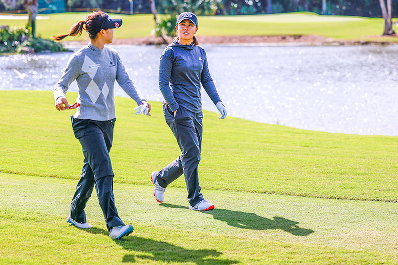 Lydia Ko and Danielle Kang walk on the 16th fairway during the third round of the 2022 Gainbridge LPGA at Boca Rio Golf Club on January 29, 2022 in Boca Raton, Florida. (Photo by Douglas P. DeFelice/Getty Images)