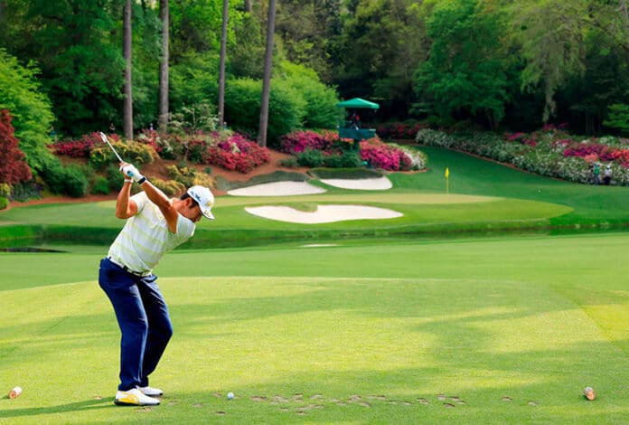 Rolex Testimonee Hideki Matsuyama Plays A Stroke From The No. 12 Tee During The Final Round At The 85th Masters